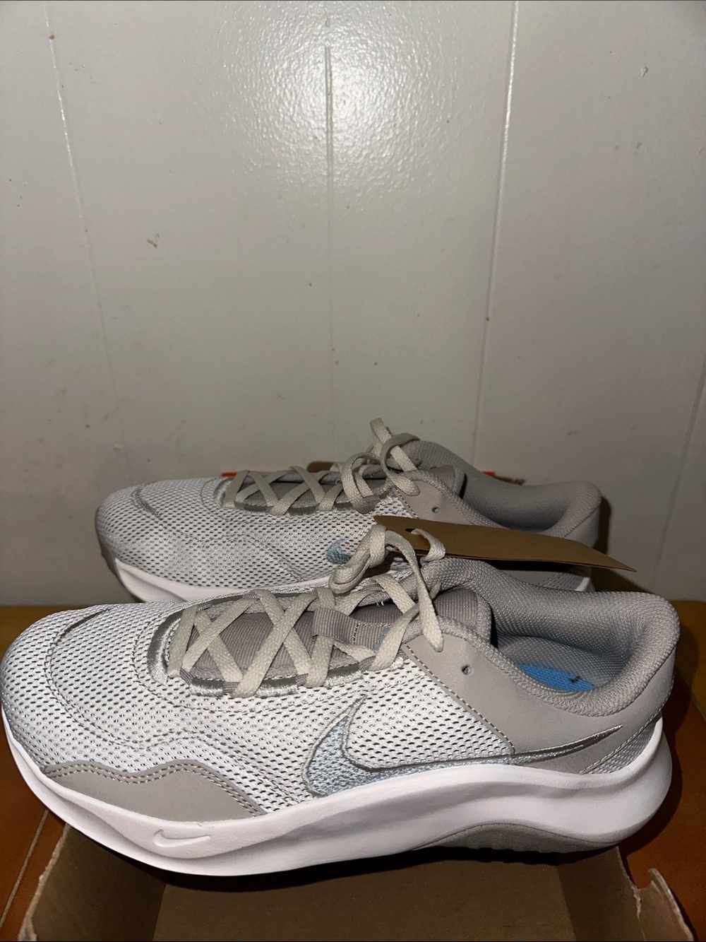 Nike Light Gray Mesh Sneakers with Silver Swoosh box is damaged